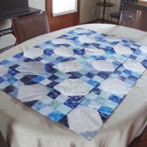 Snowball and nine patch quilt in blue, white and gray